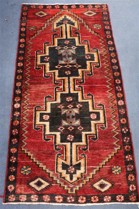 A Hamadan red ground rug, 6ft 2in by 3ft 1in.